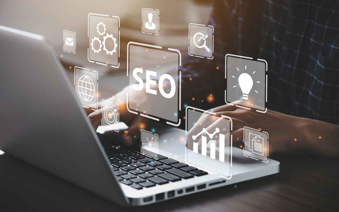Businessman using a computer for analysis SEO Search Engine Optimization Marketing Ranking Traffic Website Internet Business Technology Concept; benefits of website optimization